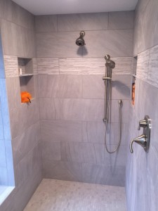 Dual shower heads are one of the luxuries of an upscale bathroom remodel.